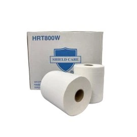 Rolls of white hardwound towels in front of their box.